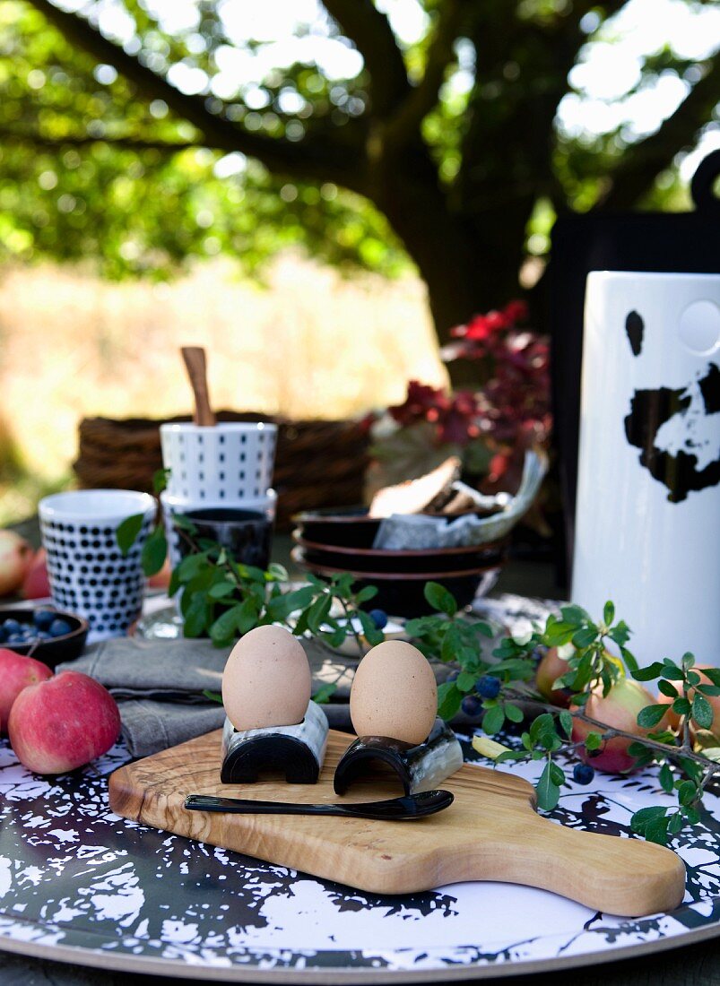 Boiled eggs on breakfast table in garden