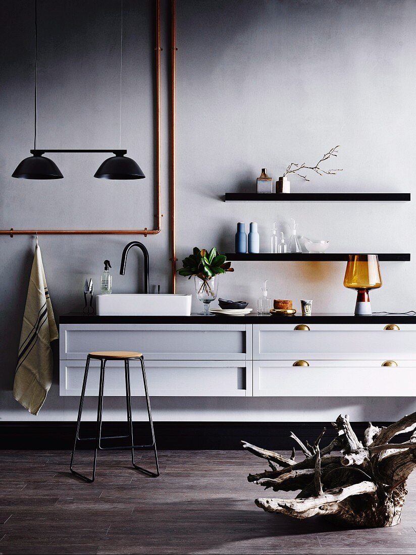 Kitchen counter in purist loft style with pendant lamps above sink