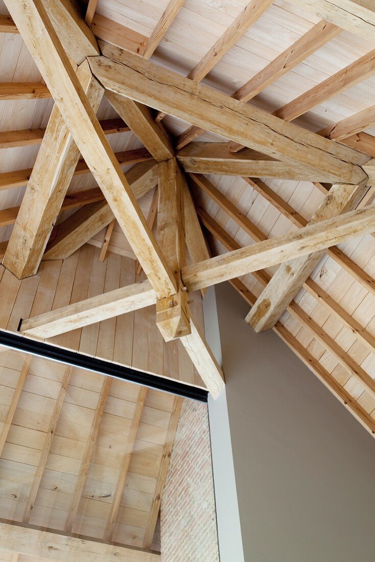 Wooden roof structure in high-ceilinged room