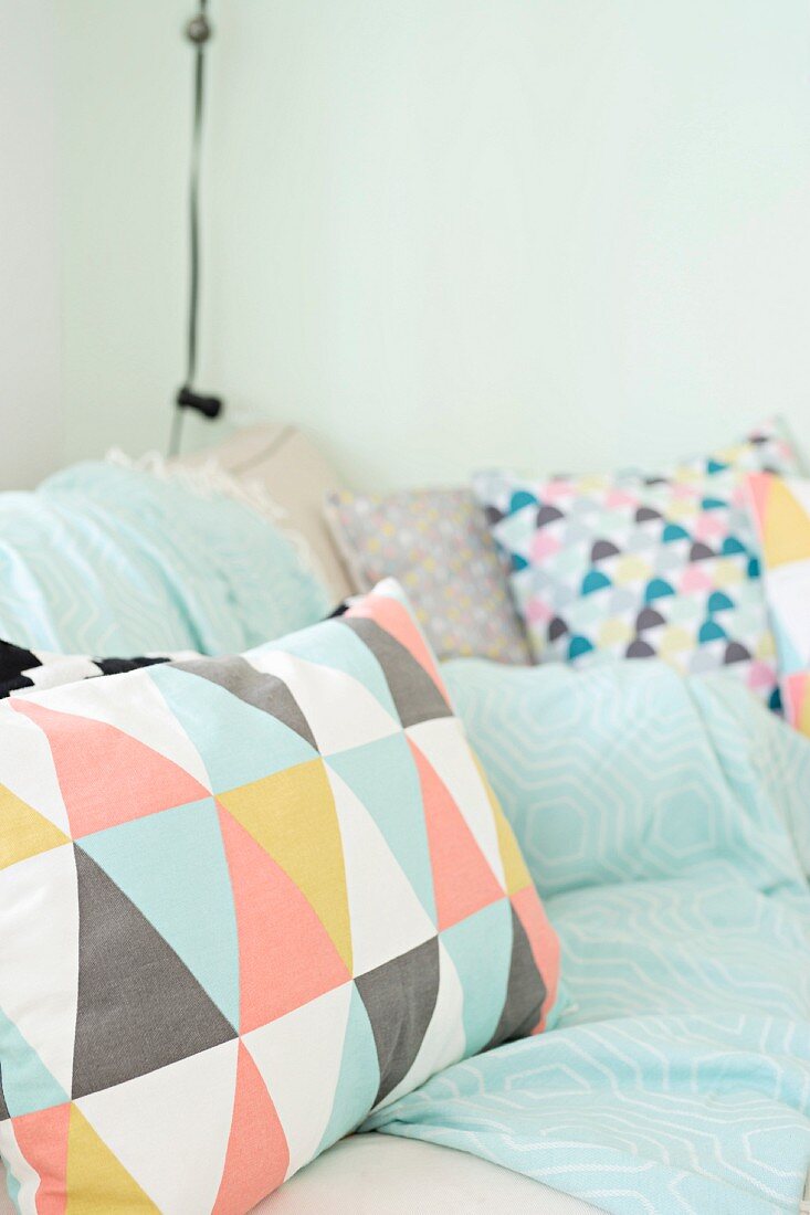 Scatter cushions with colourful graphic patterns