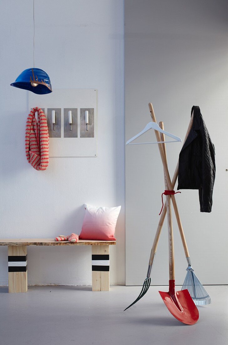 DIY wooden bench, coat stand made from disused gardening tools and pendant lamp made from hard hat