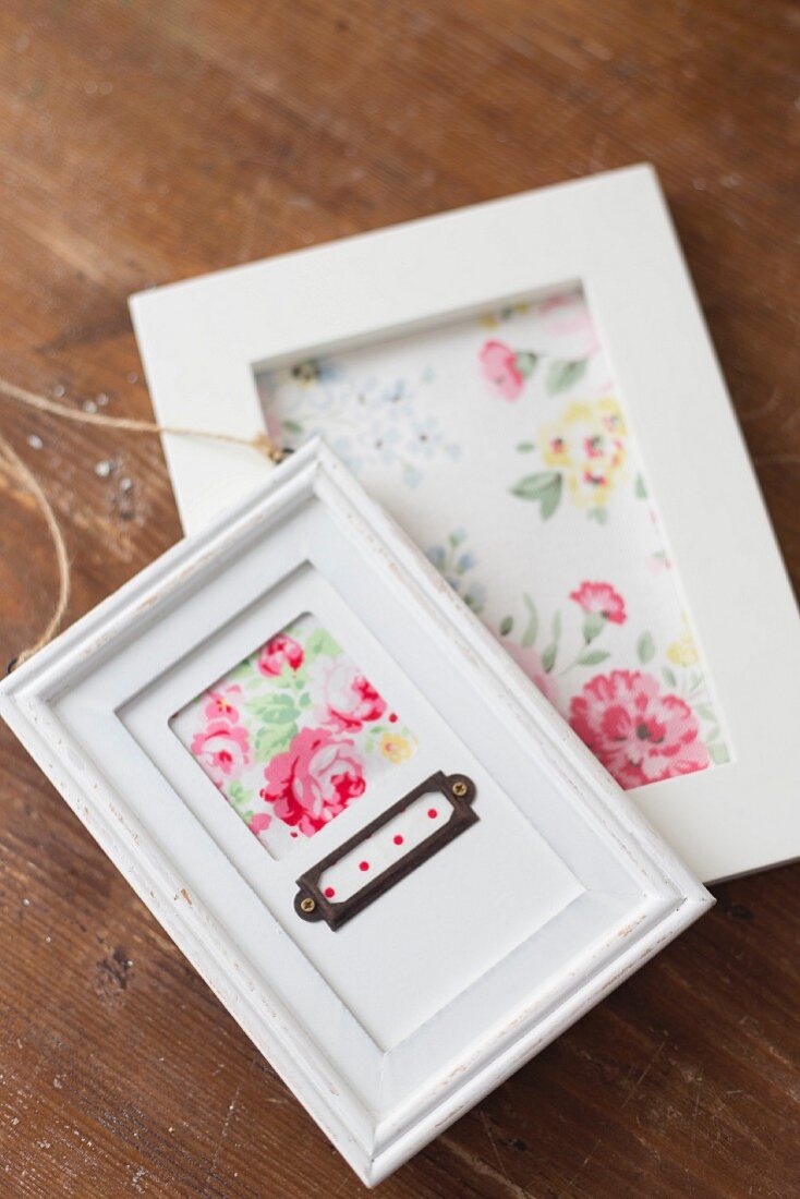 Hand-made pictures with rose motifs