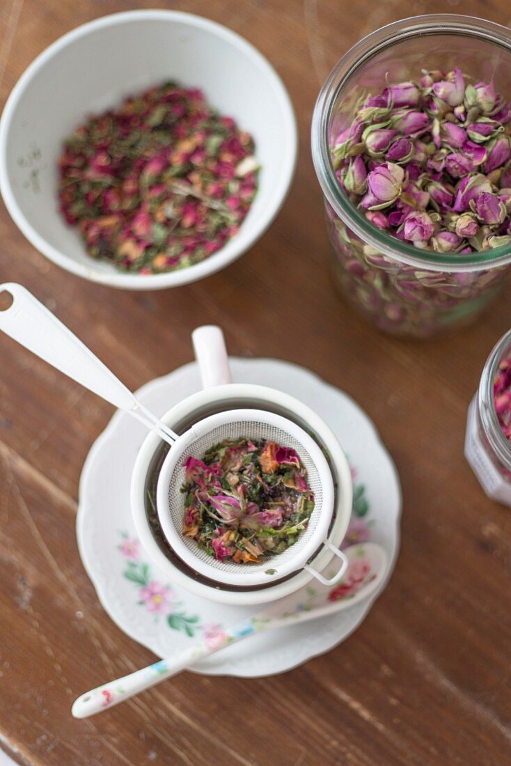 Brewing an infusion of dried rose petals