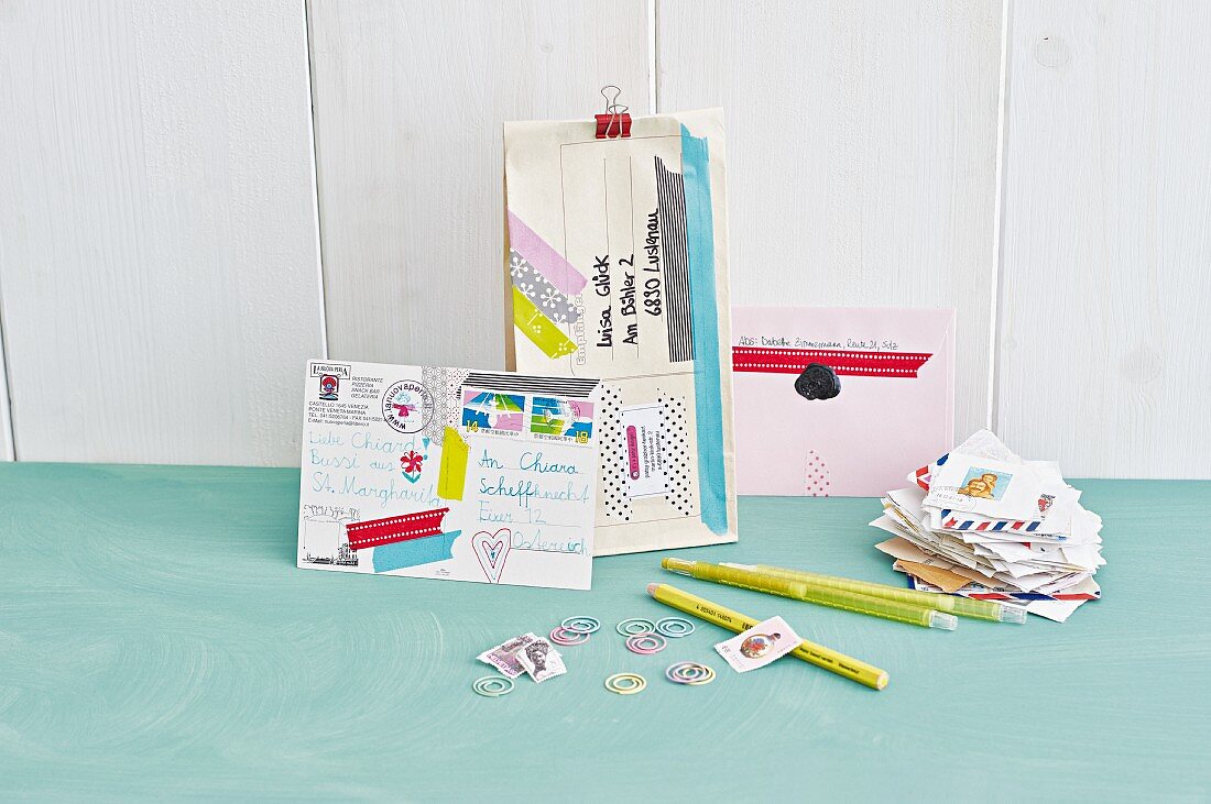 Postcards and letter decorated with colourful washi tape