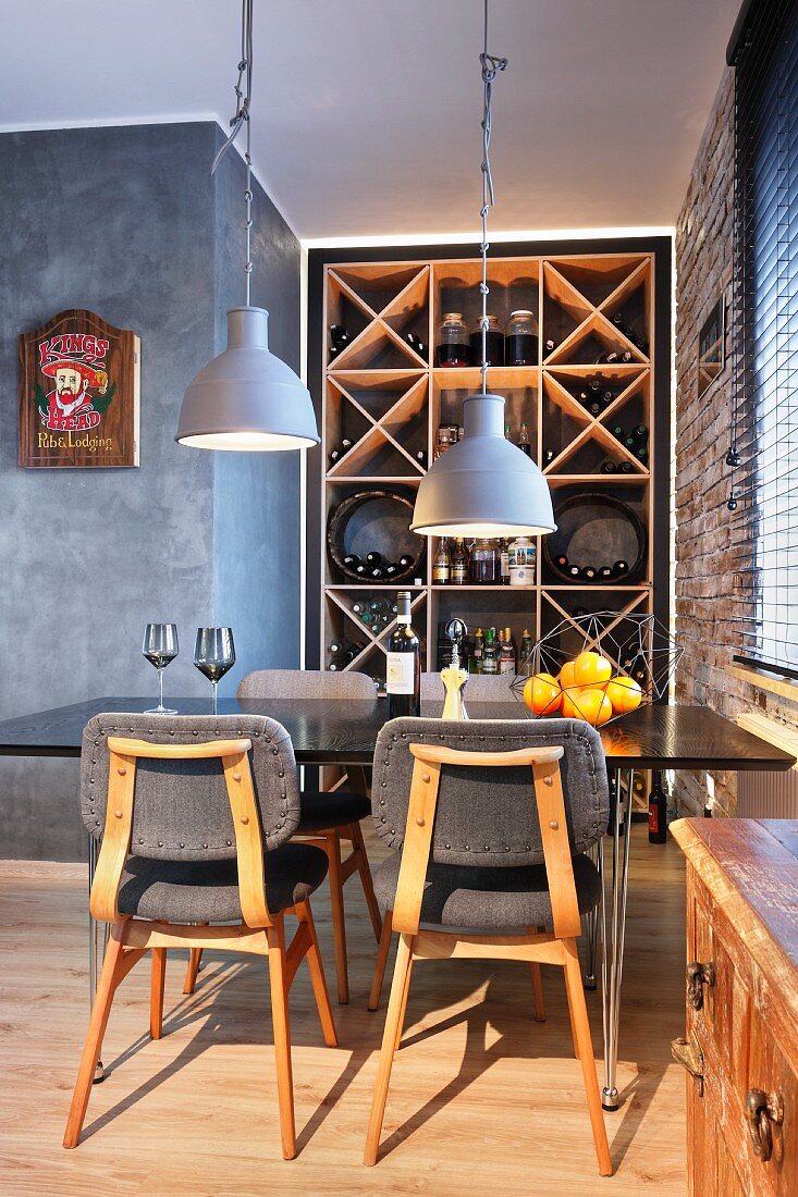 Retro dining area in front of wine rack in niche