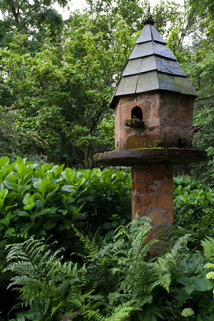 Vintage brick dovecote in garden