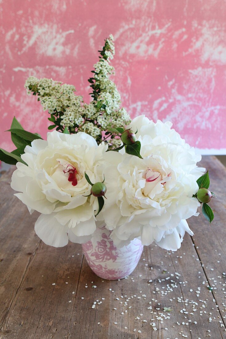 Bunch of white peonies with red centres