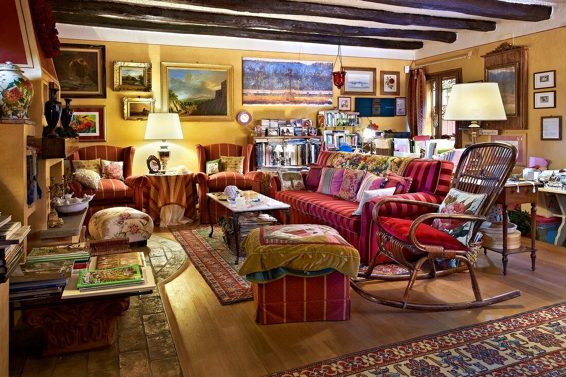 Rustic interior crammed with pictures and rugs