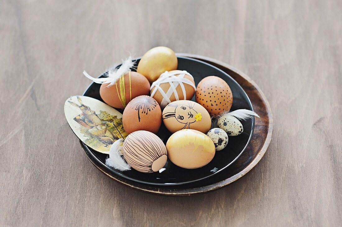 Easter eggs painted using natural dyes & decorated with ribbons & feathers