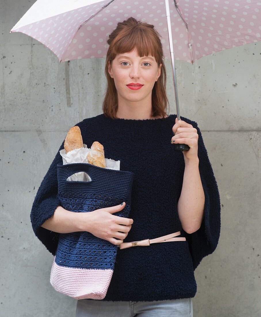 A young woman with a self-crocheted shopping bag