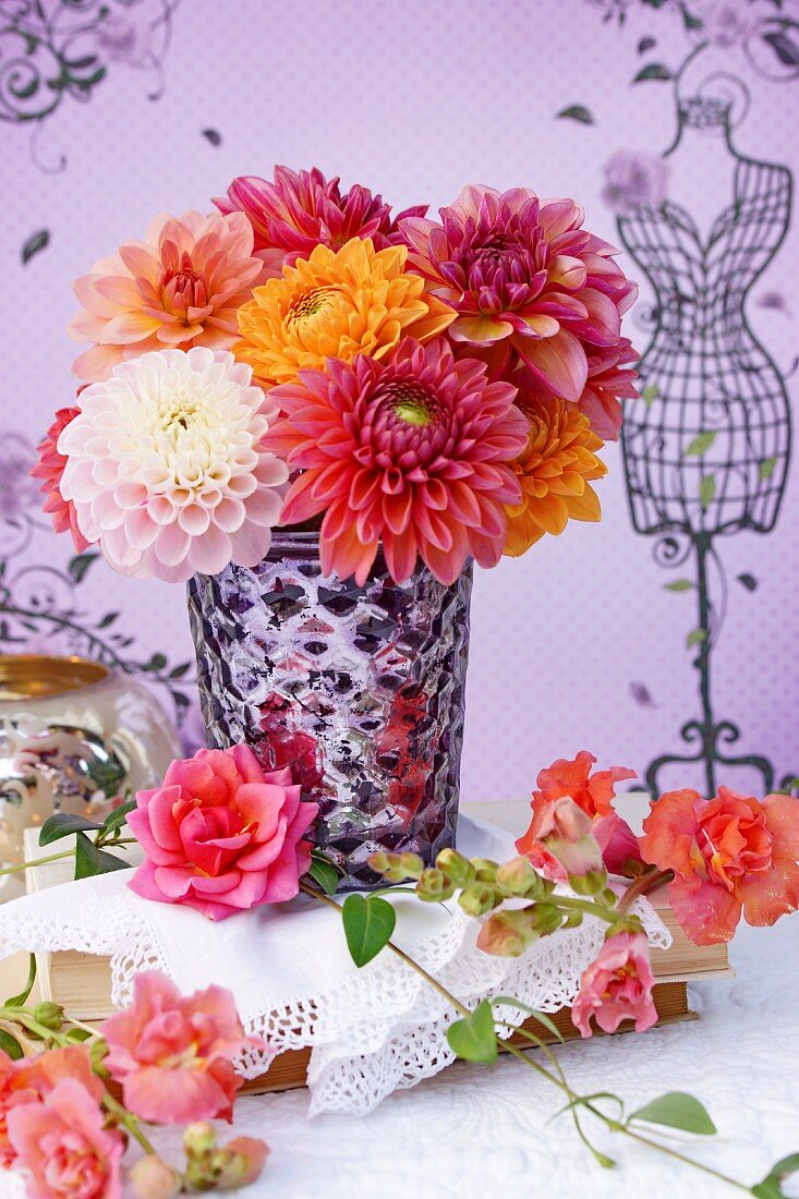 Bouquet of dahlias in silvered glass vase
