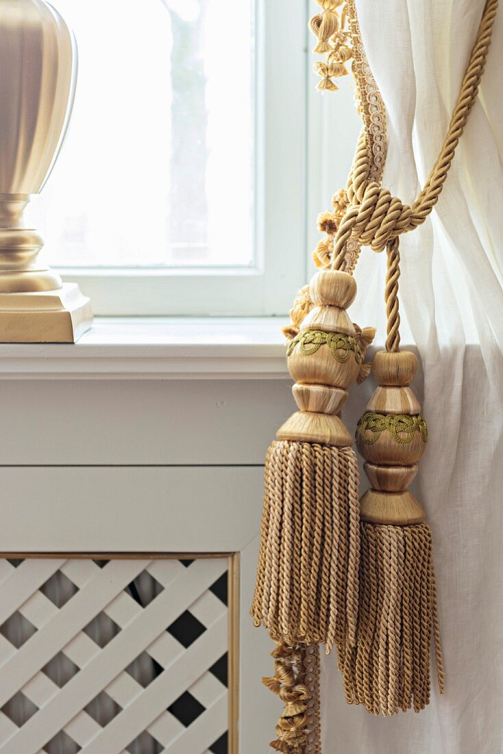 Golden cord curtain tie-backs with tassels