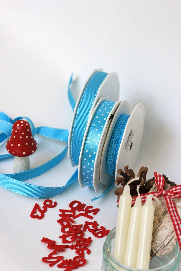 Craft utensils & decorations: ribbons, decorative numbers, toadstool ornament, pine cones & candles