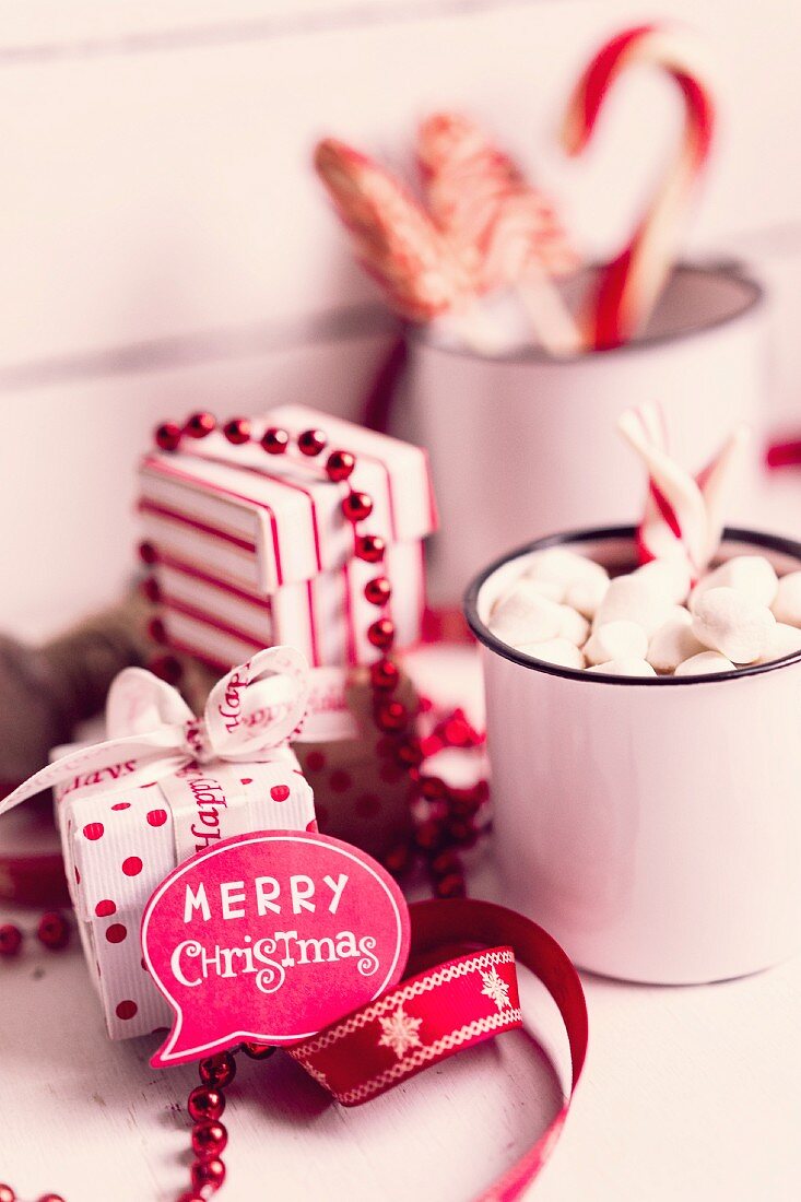 Speech bubble reading 'Merry Christmas', sweeties and red and white gift box