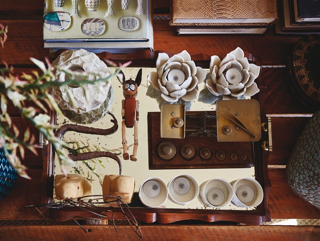 Collection of various objects on mirrored tray