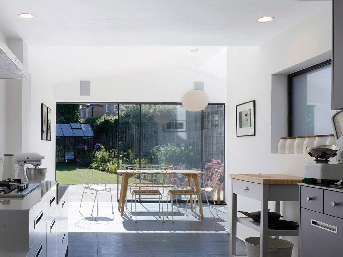 Bright kitchen with dining area next to terrace doors
