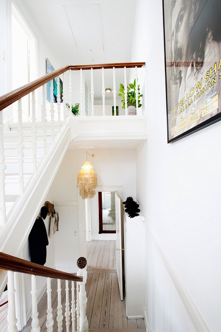 White wooden staircase in restored period apartment