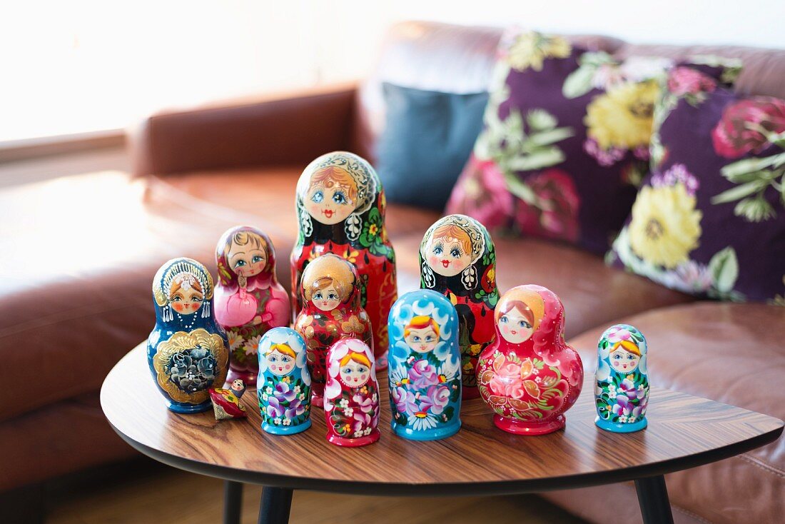 Collection of Russian dolls on retro coffee table