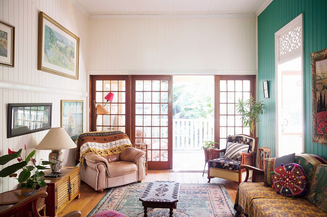 Old-fashioned living room with lattice doors to the veranda