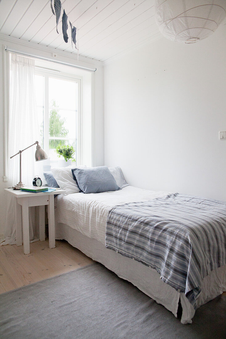 Simple bedroom in white and blue