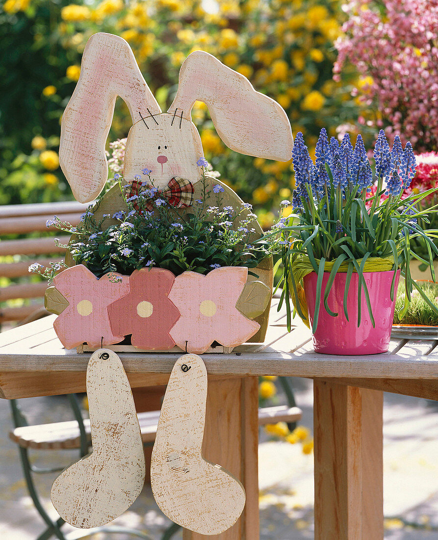 Wooden hares with myosotis (forget-me-not)