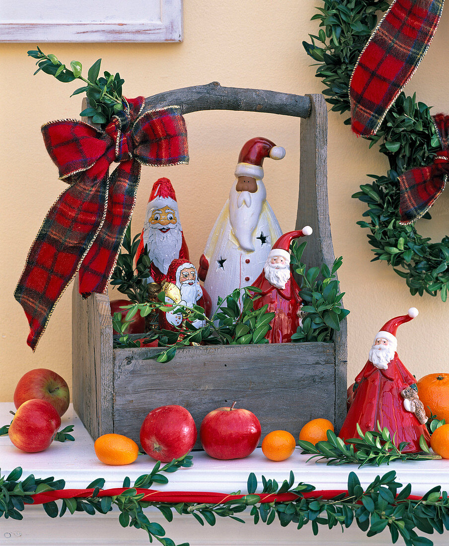 Santa Claus made of chocolate and porcelain in wooden box