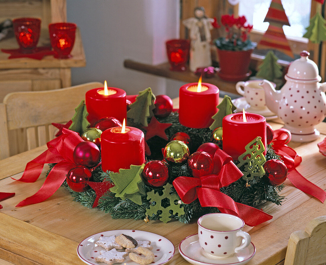 Advent abies (fir) wreath with red candles and bows