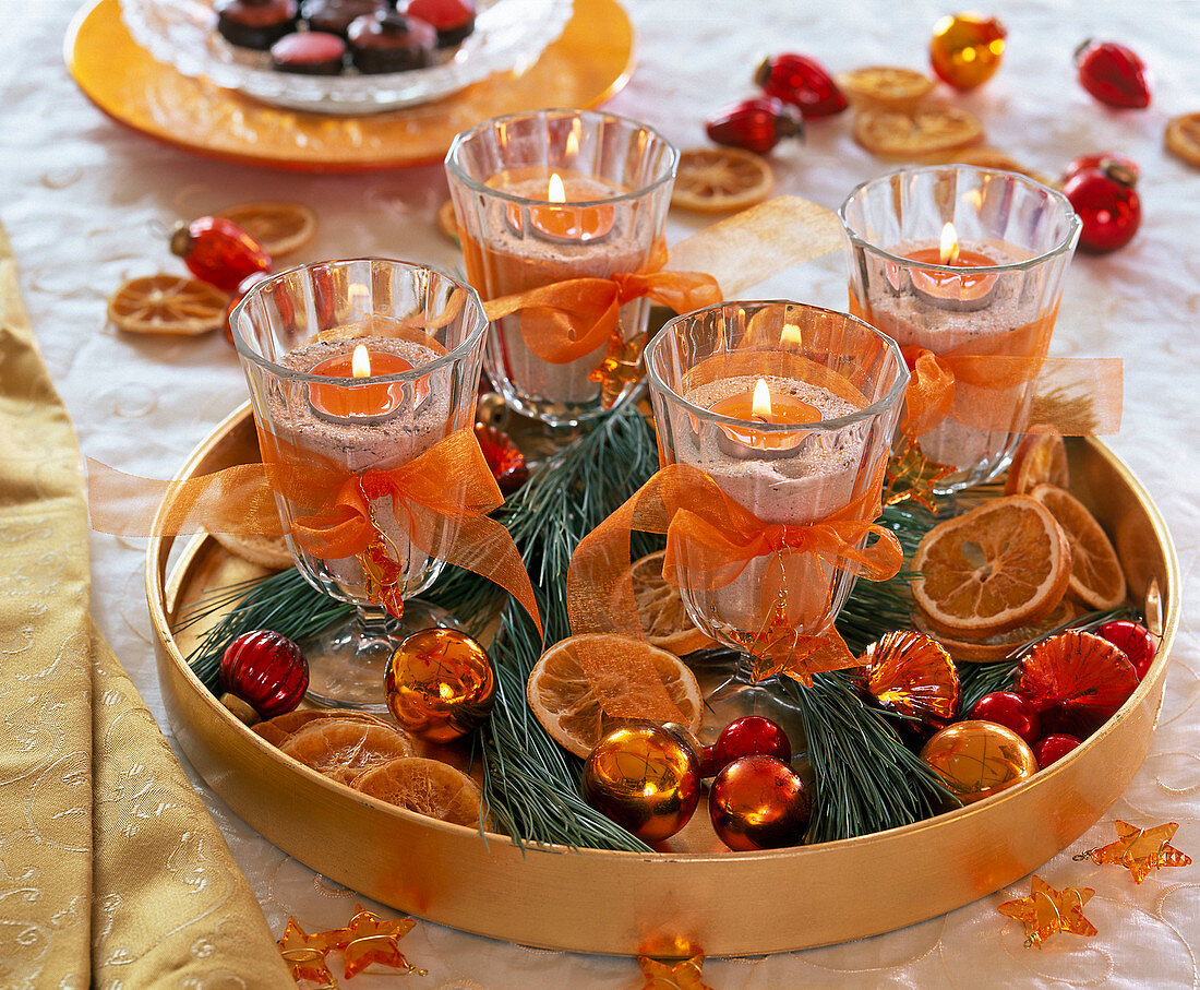 Unusual Advent wreath on tray with wine glasses