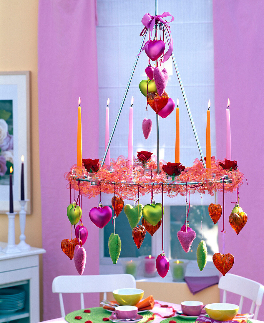 Hanging table decoration, candle wreath decorated with candles and ribbon