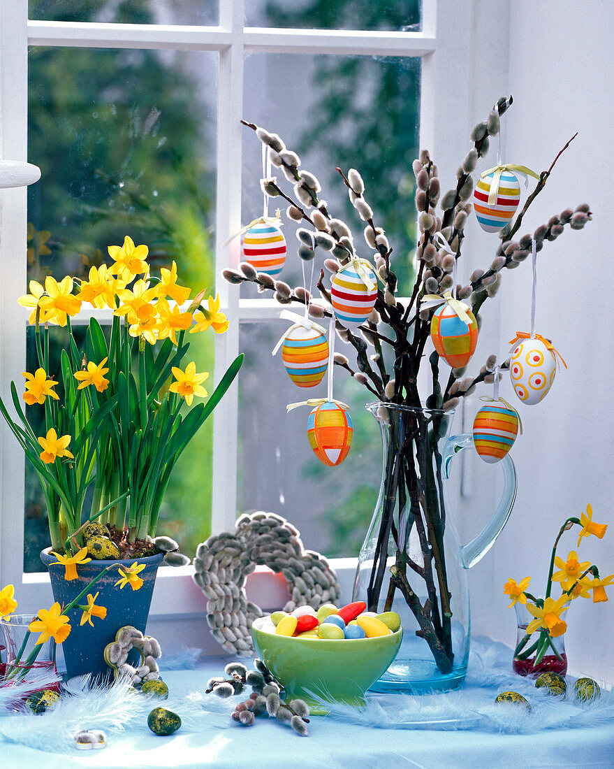 Narcissus in a pot, bouquet from Salix with Easter eggs