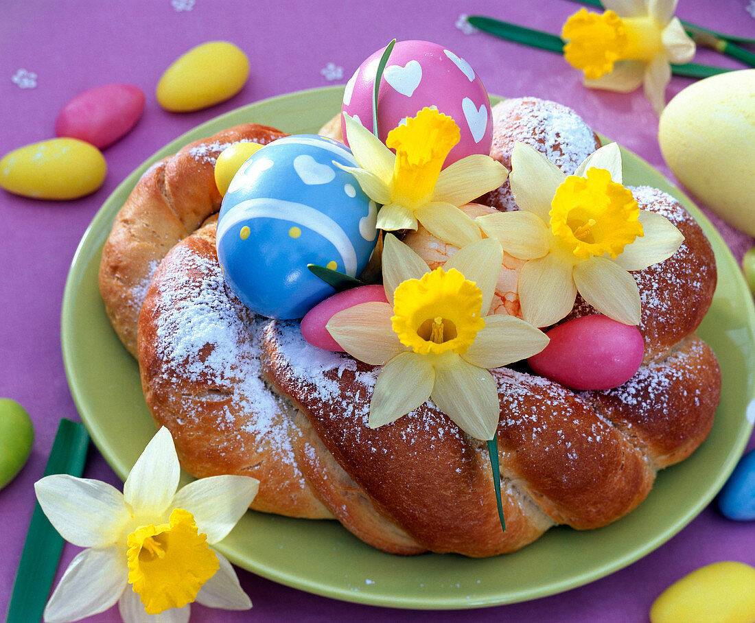 Easter nest made of yeast dough with Narcissus (Daffodil) flowers