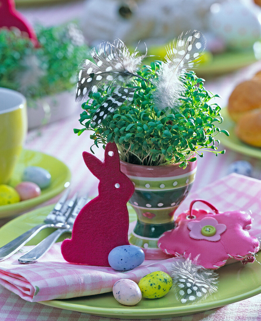 Easter table decoration with Lepidium in a striped eggcup