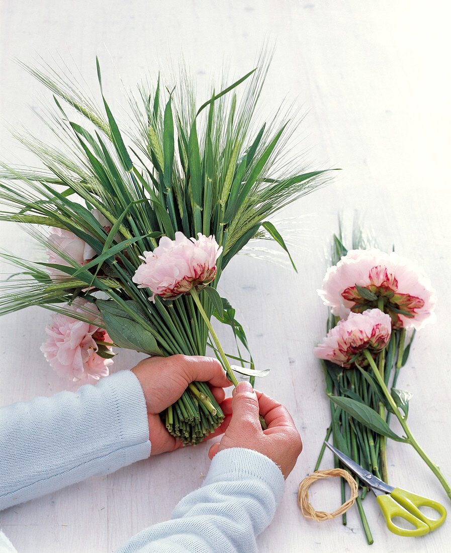 Barley and peonies stems as a standing bouquet