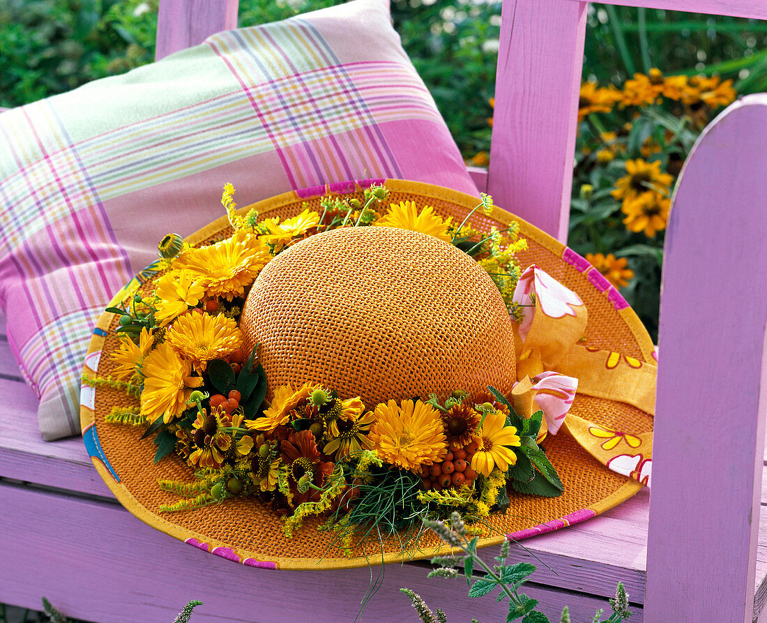 Orange hat decorated with a late summer wreath