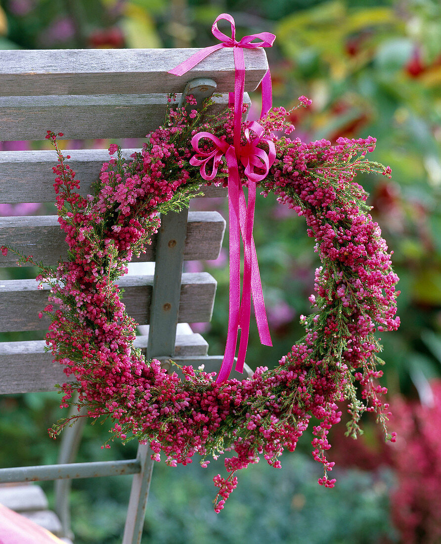 Wreath from Erica (Heath) tied with band on back by wooden chair