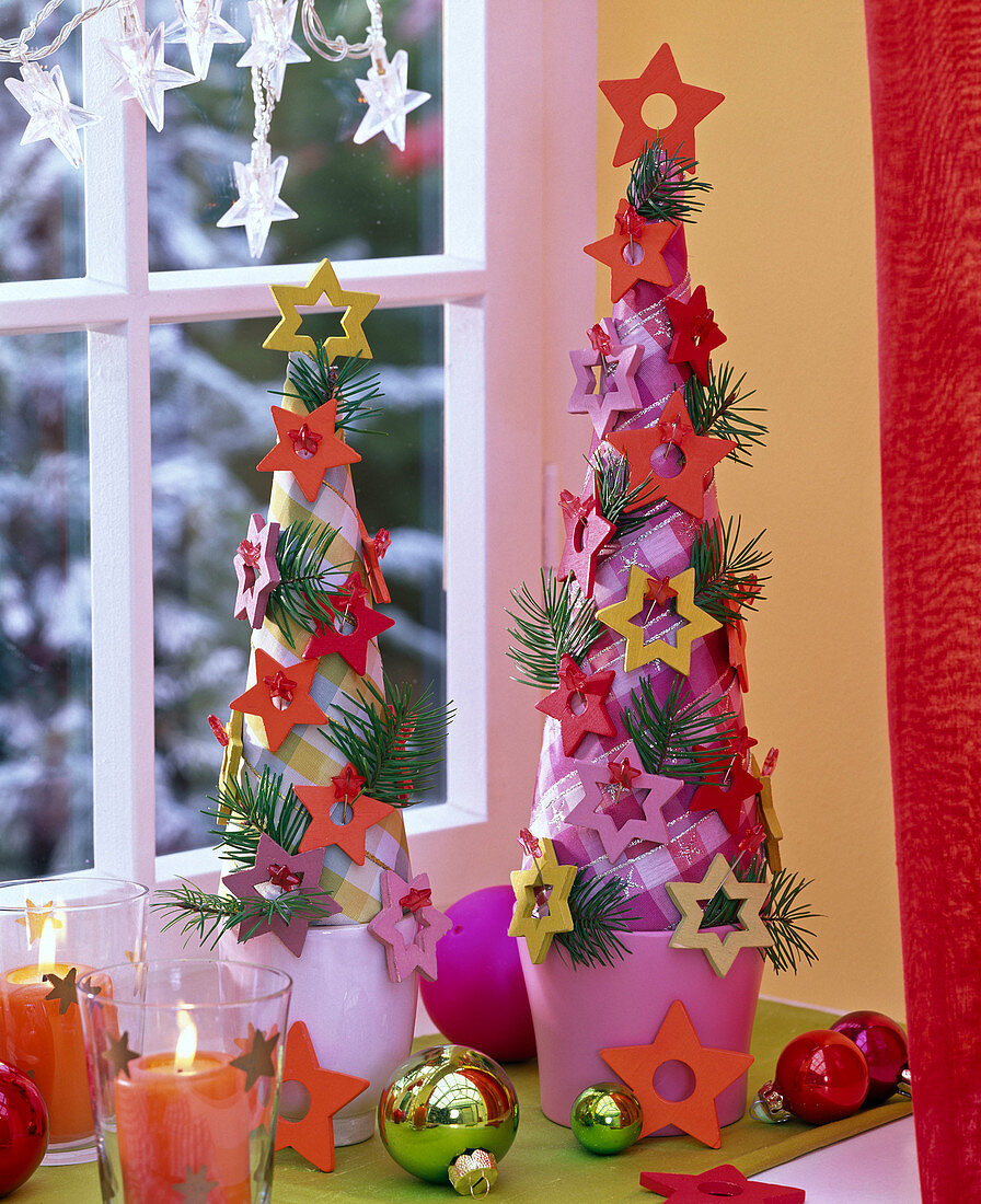 Cones wrapped with ribbons as stylized Christmas trees, with stars