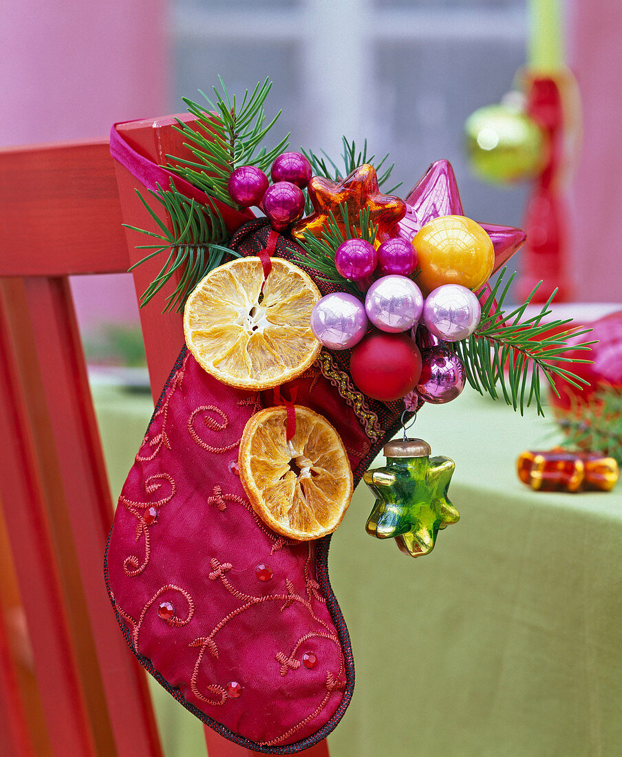 Red Santa Claus shoe with dried citrus slices