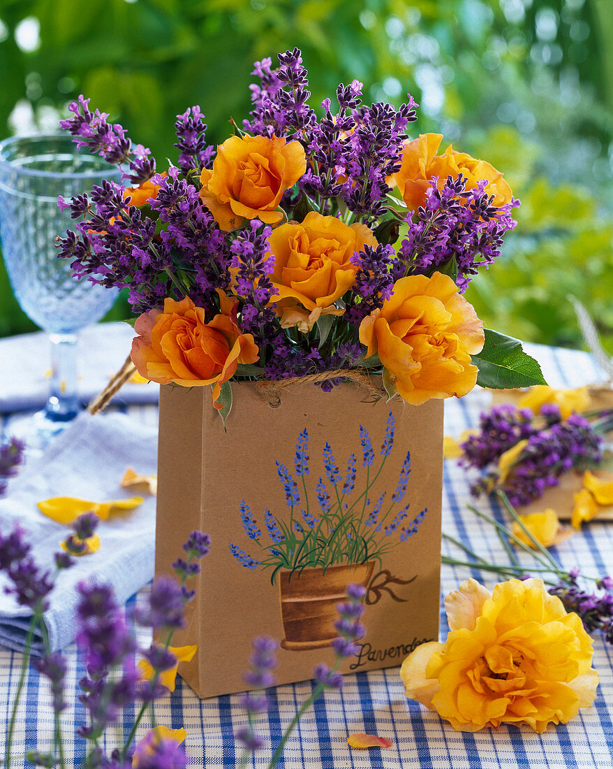 Bouquet of roses and lavender in paper bag