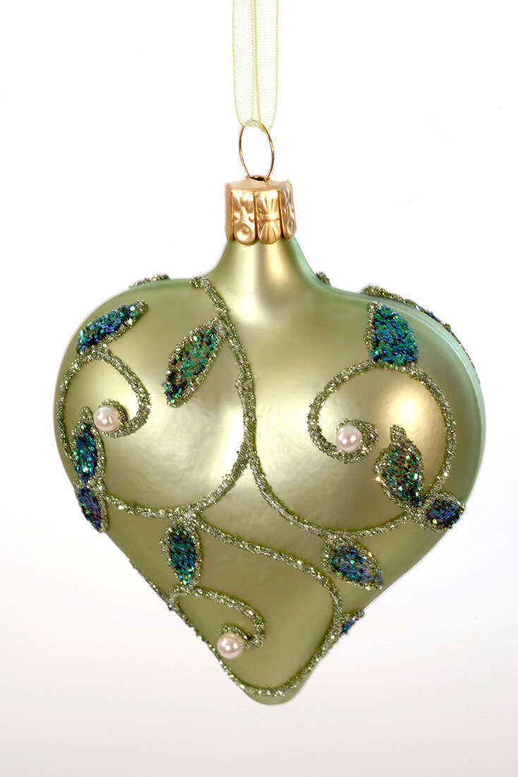 Green heart with tendrils as Christmas tree decoration, cut out