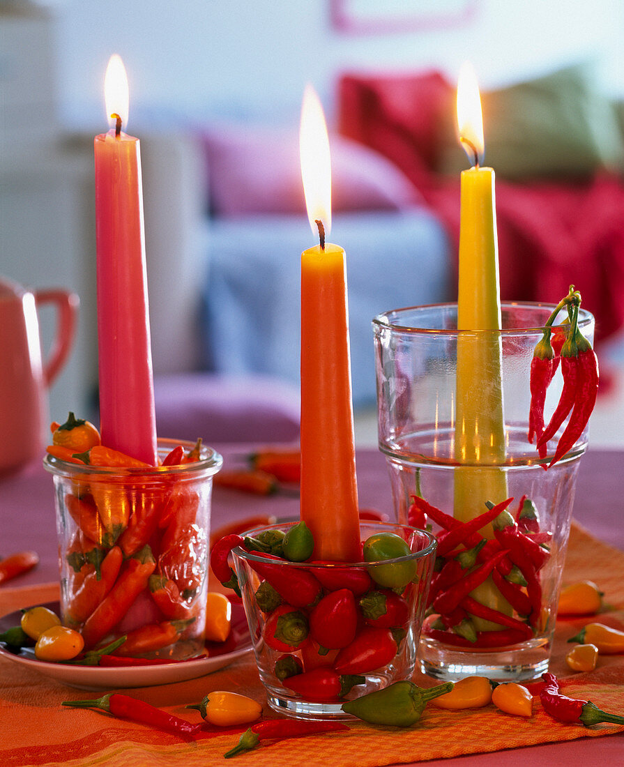 Capsicum in small glasses as a candle holder