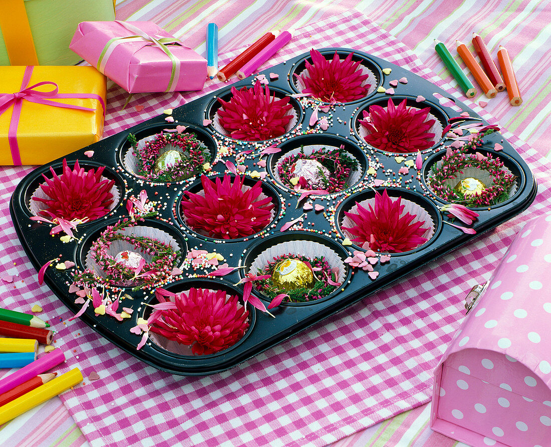 Muffin tin backing form filled with Dahlia flowers, small wreaths