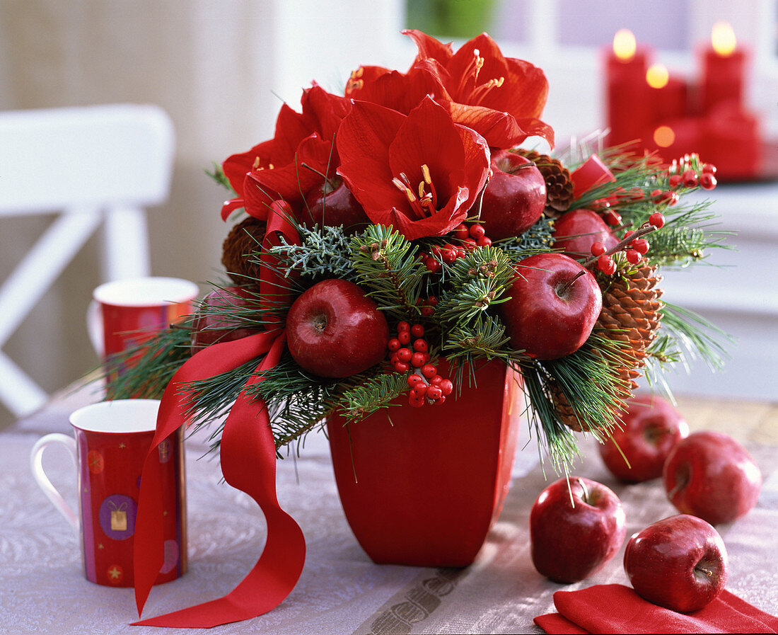 Red christmas bouquet with amaryllis and apples