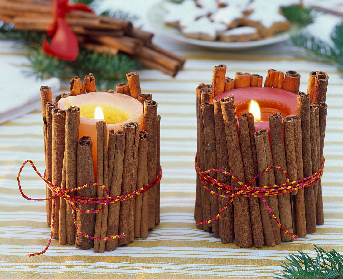 Candles with cinnamon sticks cased