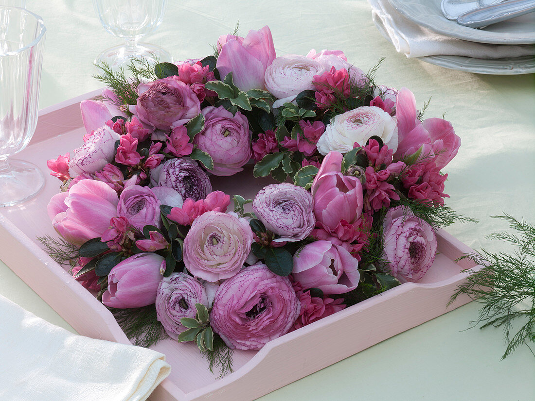 Spring wreath with ranunculus, tulipa, rhododendron