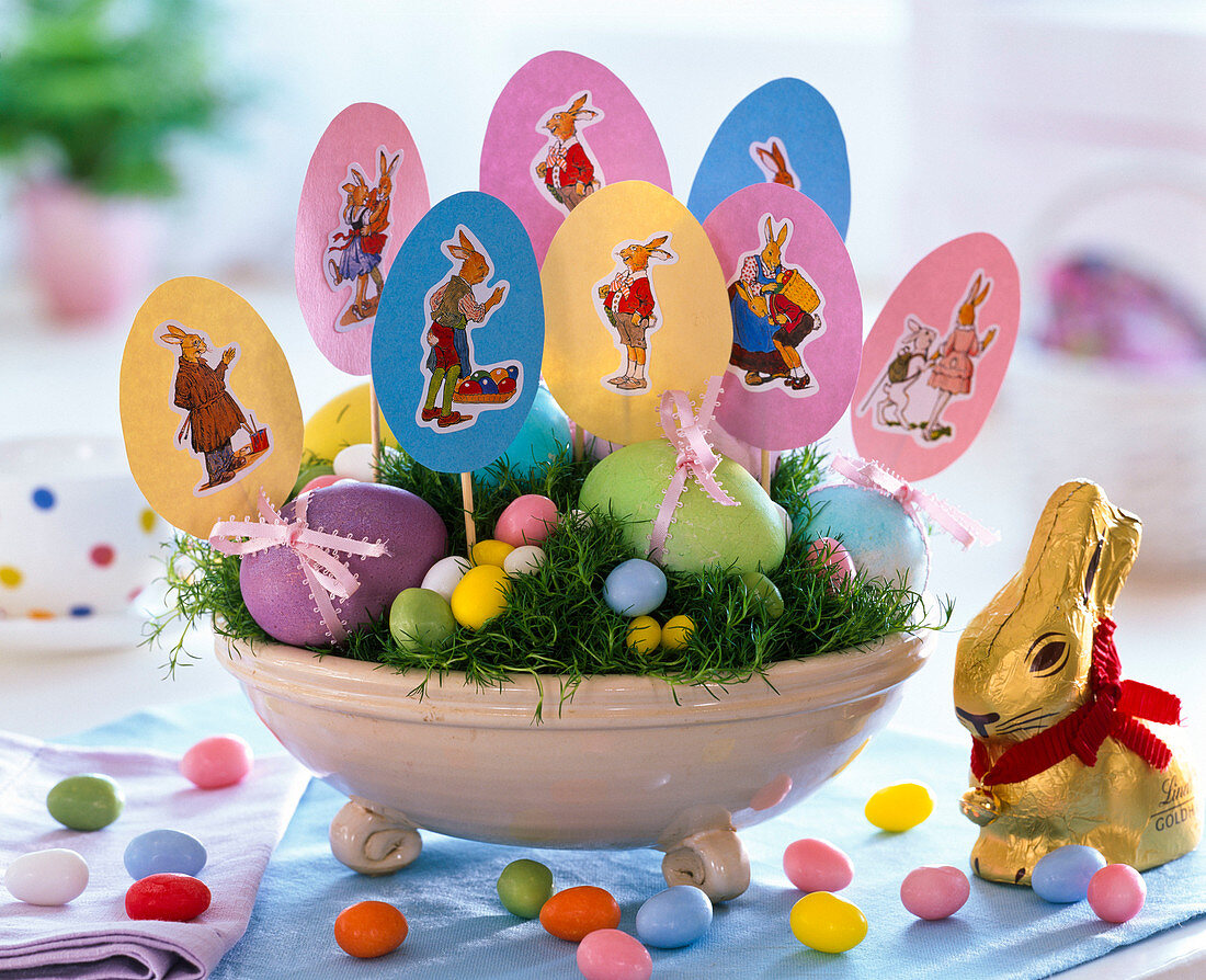 Easter nest with Sagina, Easter eggs, paper eggs with wafer hare