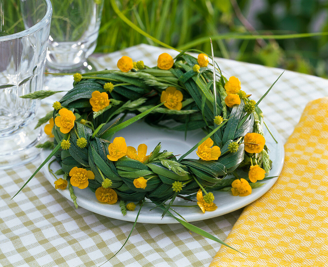 Wreath of grasses with ranunculus (buttercup) flowers