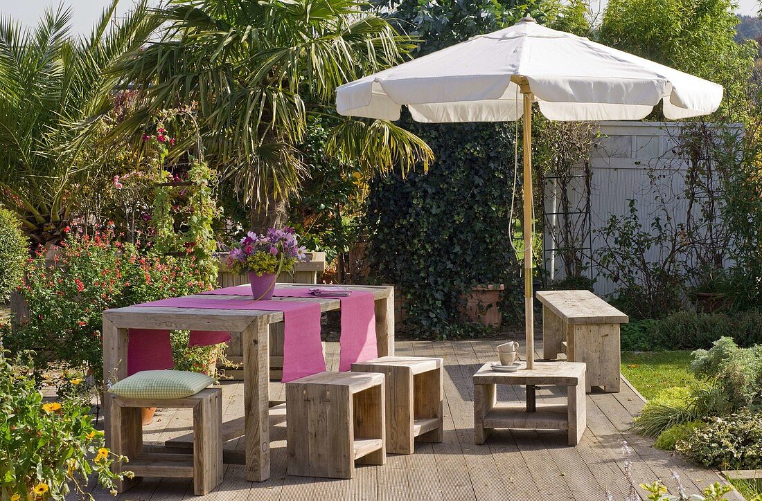 Terrace with furniture made of old timber