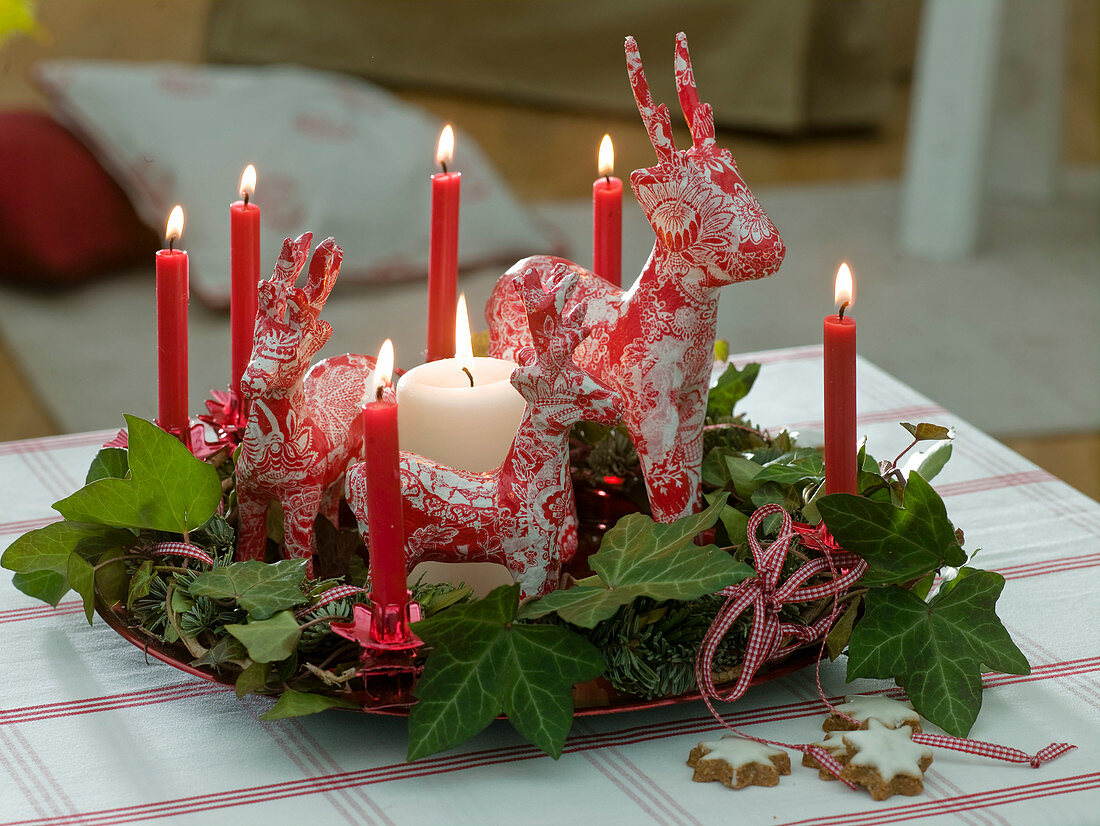 Papier-mâché reindeer on a abies (fir) wreath