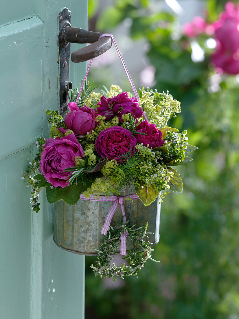 Rose herb bouquet hung on door