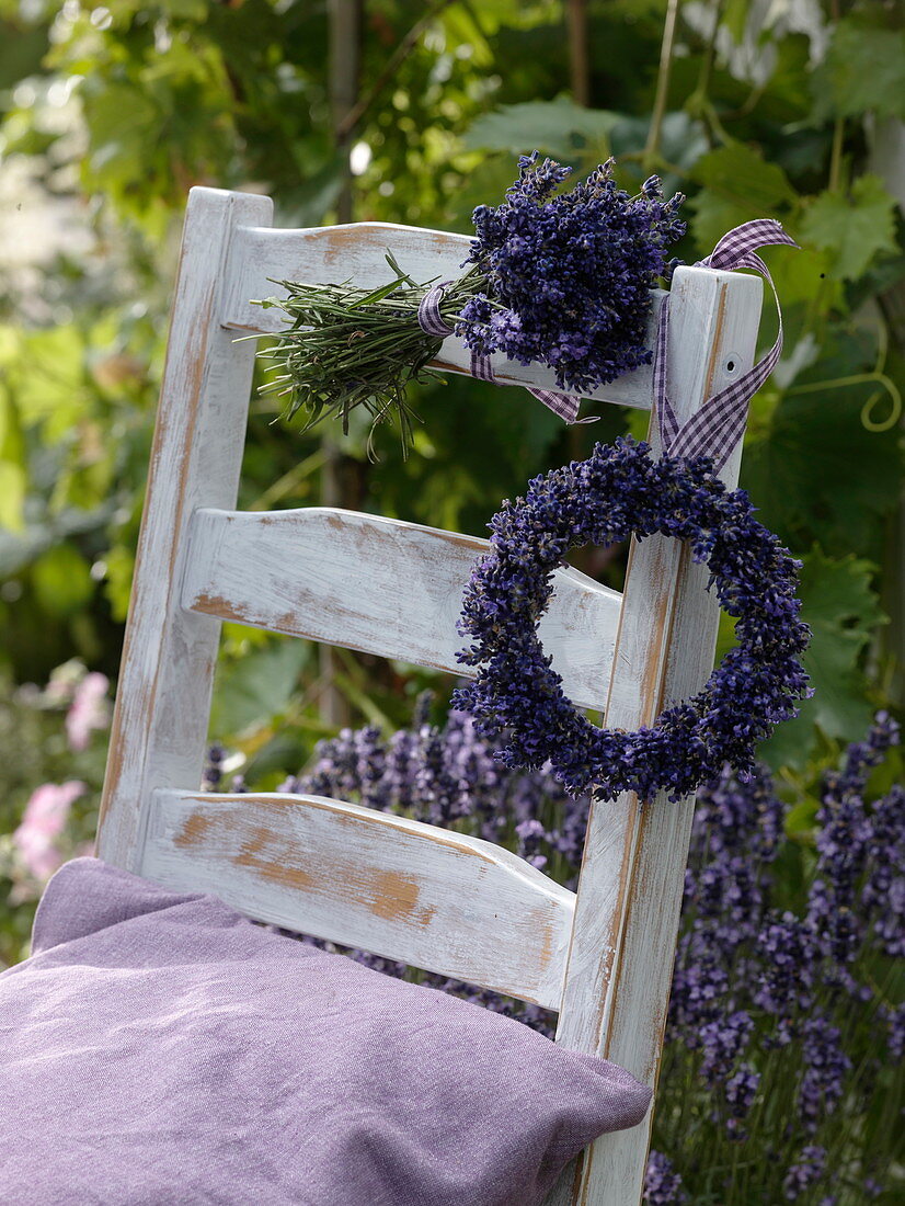 Bouquet and wreath from Lavandula hung on chair back